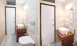 A bathroom with a toilet, sink, and mirror. - FabHotel Trishiv - Newtown Kolkata (Barasat)