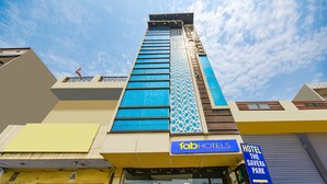 A hotel with a prominent sign for 'Tab Hotels' and a 'Hotel The Savera Park' sign. - Fabhotel Savera Park (Amritsar)