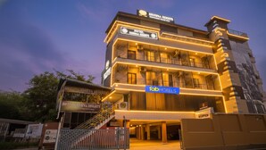 A multi-story hotel with a modern facade, multiple balconies, and a reception area. - Fabhotel Krishna Heights (Dehradun)
