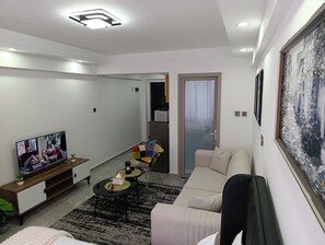 Deluxe Studio Suite, City View | Living area | 24-inch Smart TV with digital channels - Gatundu Heights Apartments Kileleshwa (Nairobi)
