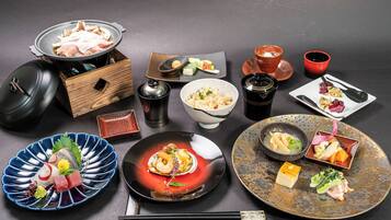A variety of Japanese dishes and utensils arranged on a table.