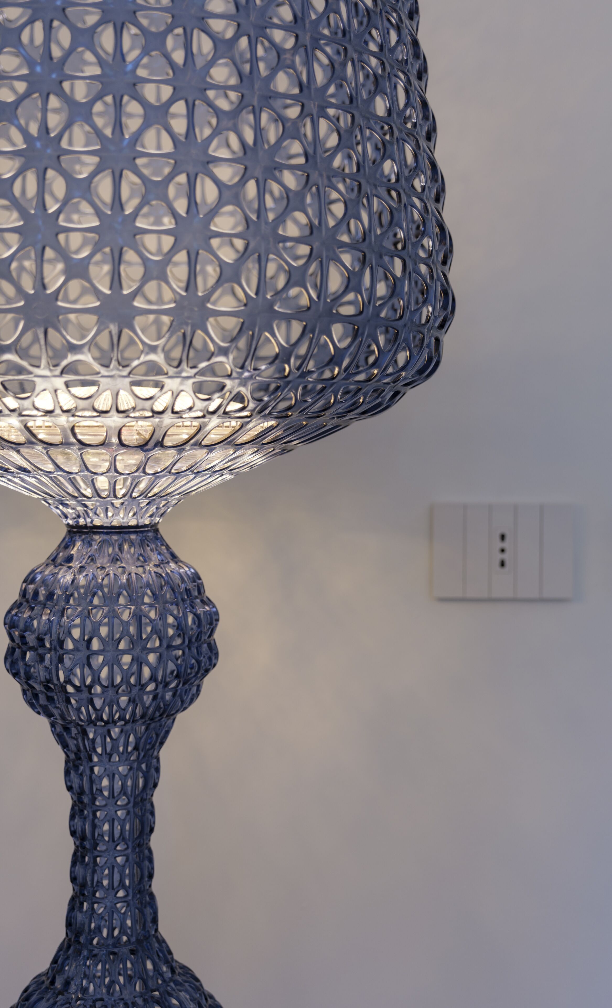 A lamp with a detailed, geometric pattern.