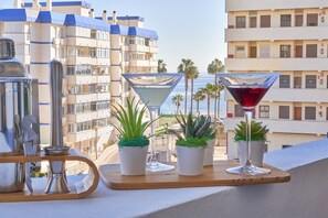 Enjoy the ocean view from your balcony, surrounded by lush greenery and modern architecture.