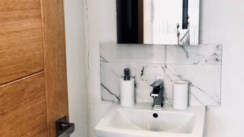 Hair dryer, towels, soap, toilet paper