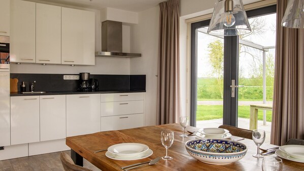 Fridge, stovetop, dishwasher, coffee/tea maker