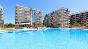 A swimming pool surrounded by high-rise residential buildings. - S333-190 LARIMAR SUPERIOR FAMILY COMPLEX (Salou)