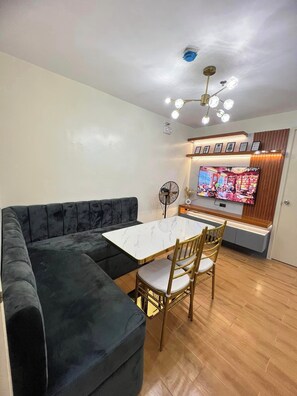 Family Condo, Balcony, Partial Sea View | Living area - Seawind Condo 2 BR Free Wifi Near Samal (Davao)