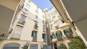 A multi-story residential building with balconies, shutters, and air conditioning units. - Don Vittorio a Chiaia - Camera 4 (Naples)