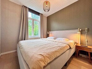 1 bedroom, desk, iron/ironing board, travel crib