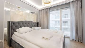 1 bedroom, desk, iron/ironing board, travel crib