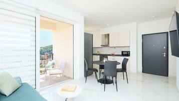 Apartment (2 Bedrooms) | Living room | 108-cm TV with cable channels