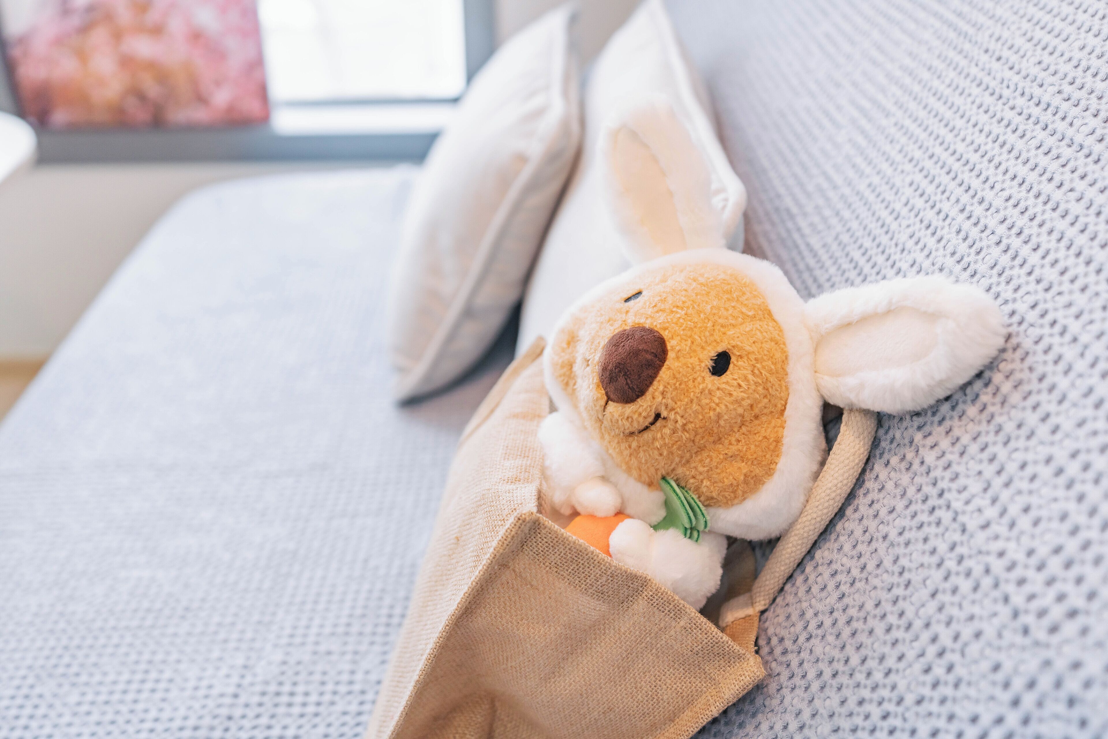 A plush toy in a cozy setting.