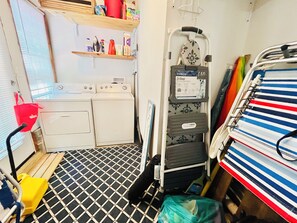 A compact laundry room with a washing machine, dryer, and a 3-step folding stool. - JUST STEPS TO THE BEACH AND DOG FRIENDLY! (DEWEY BEACH)