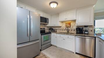 Condo, 3 Bedrooms | Private kitchen | Fridge, oven, coffee/tea maker