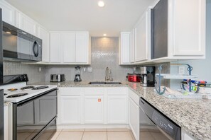Condo, 2 Bedrooms | Private kitchen | Fridge, oven, coffee/tea maker
