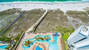 A resort with a beach, a pool area, and a modern building. - Phoenix Orange Beach Ii 1602 3 Bedroom Condo (Orange Beach)