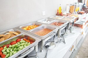 A buffet with various food options including pancakes, beans, and vegetables. - Palm Oasis At Ukulhas (Ukulhas)