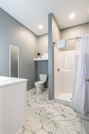 Shower, free toiletries, towels, soap