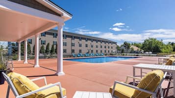 Seasonal outdoor pool, open 8:00 AM to 10:00 PM, pool umbrellas