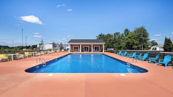 Seasonal outdoor pool, open 8:00 AM to 10:00 PM, pool umbrellas