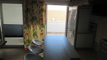 Villa (Two Bedroom Apartment with Balcony) | Private kitchen | Fridge