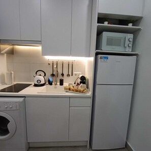 Fridge, microwave, stovetop, coffee/tea maker