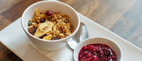 Two bowls of food on a white tray.