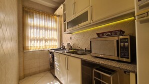 Fridge, microwave, oven, cookware/dishes/utensils