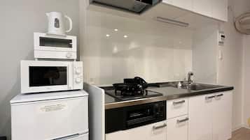 Fridge, microwave, electric kettle, cookware/dishes/utensils