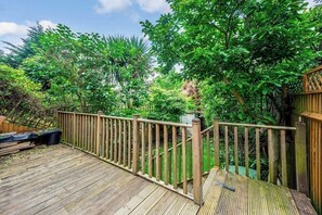 Surrounded by lush greenery, this outdoor space offers a serene view of the natural surroundings.