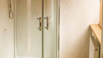 Shower, rainfall showerhead, designer toiletries, hair dryer