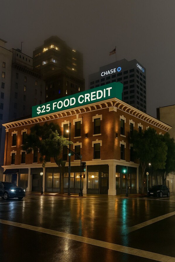 A building with a sign reading "$25 FOOD CREDIT" and a Chase bank logo. - The Beau Hotel Gaslamp Quarter San Diego (San Diego)