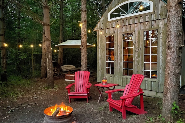 Enjoy a romantic fire by a frog pond in the woods.
