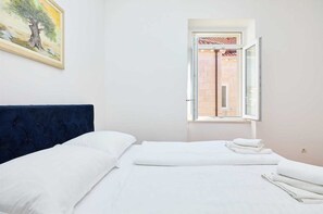 2 quartos, Wi-Fi de cortesia, roupa de cama