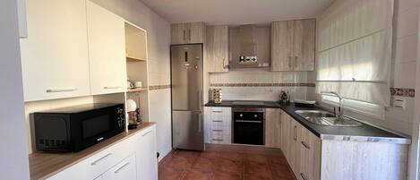 Fridge, microwave, oven, cookware/dishes/utensils