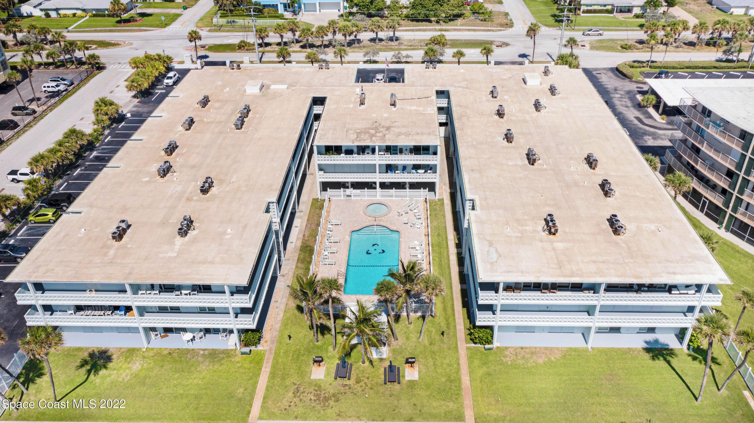 Oceanfront resort-style property with a pool and a view.