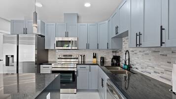 Mini-fridge, microwave, stovetop, coffee/tea maker