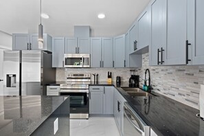 Mini-fridge, microwave, stovetop, coffee/tea maker