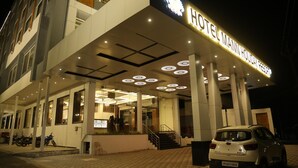 A hotel entrance with a sign reading "HOTEL MANN HOLIDAY RESORT". - Mann Holiday Resort (Burhanpur)