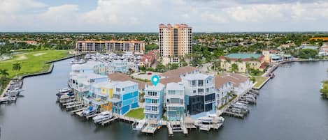 A waterfront property with multiple buildings, docks, and a marina.