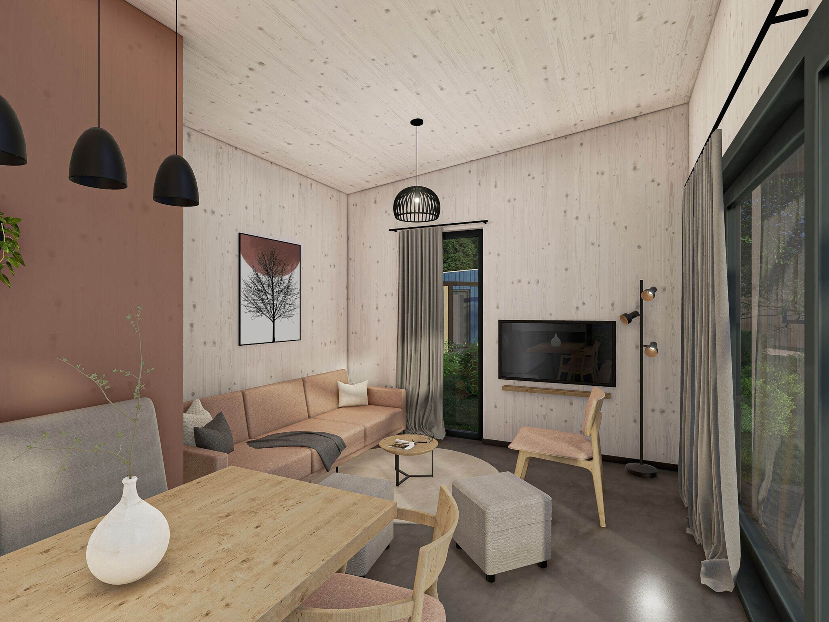 En moderne stue med sofa, sofabord og fjernsyn.