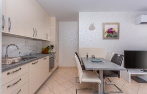 Fridge, stovetop, dishwasher, coffee/tea maker