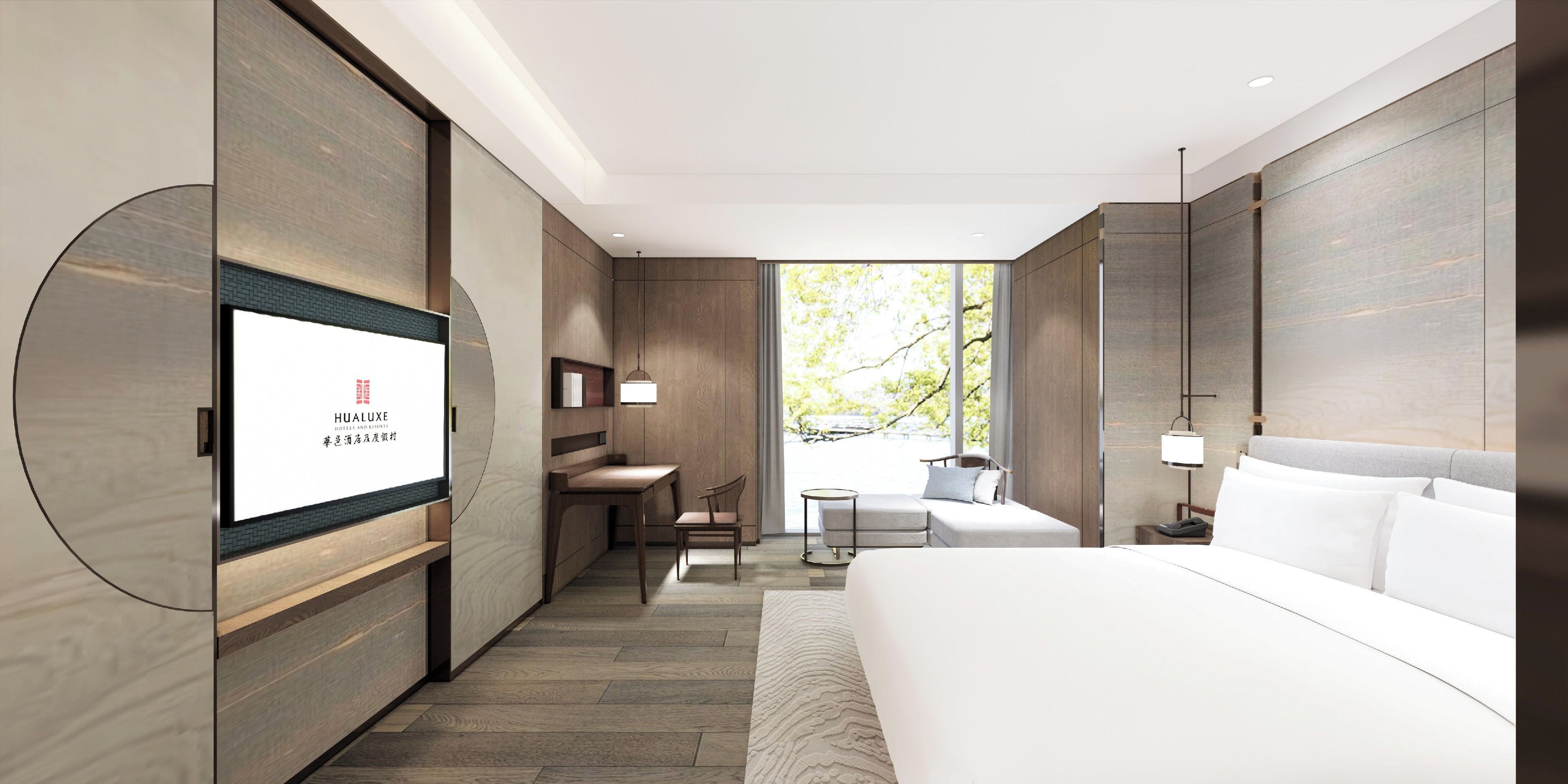 A modern hotel room with a large bed, a desk, a chair, and a TV mounted on the wall.