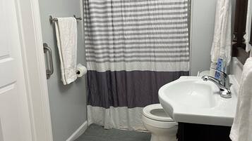 Shower, towels, toilet paper