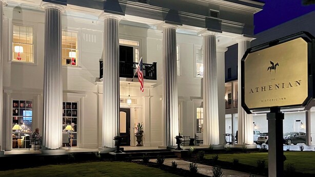 A historic inn with a grand entrance, large columns, and a flag. - Luxury Private Suite in Boutique Historic Inn The Athenian- Downtown Location (Athens)