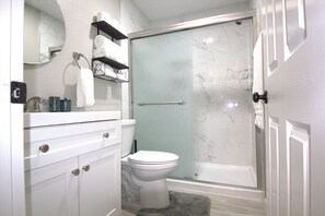 Shower, hair dryer, towels, soap