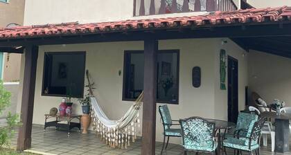 Quarto na praia com cama de casal