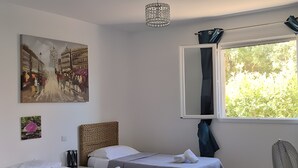 A hotel room with two beds, a large window with a view, a ceiling light fixture, and artwork on the walls. - Villa 'A Suara' with Mountain View, Private Pool and Private Terrace (Canale-di-Verde)