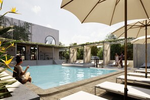 Outdoor pool, open 7:00 AM to 7:00 PM, sun loungers