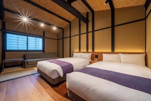 Suite Deluxe, vista al jardín | 2 habitaciones, caja de seguridad en la habitación y escritorio 